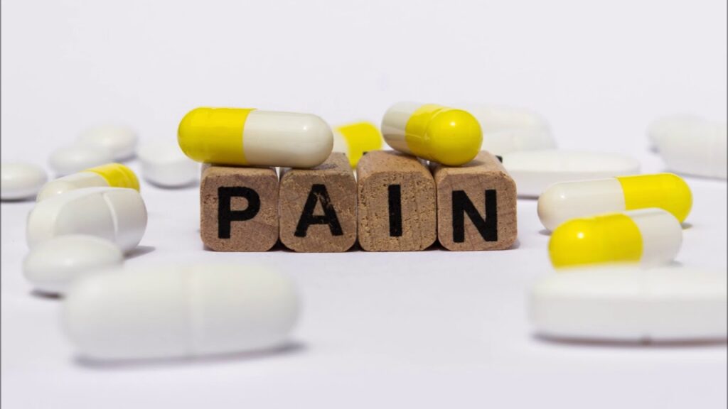 Person applying natural pain relief cream to their shoulder as part of Shoulder Pain Solutions to reduce inflammation and relieve shoulder pain.